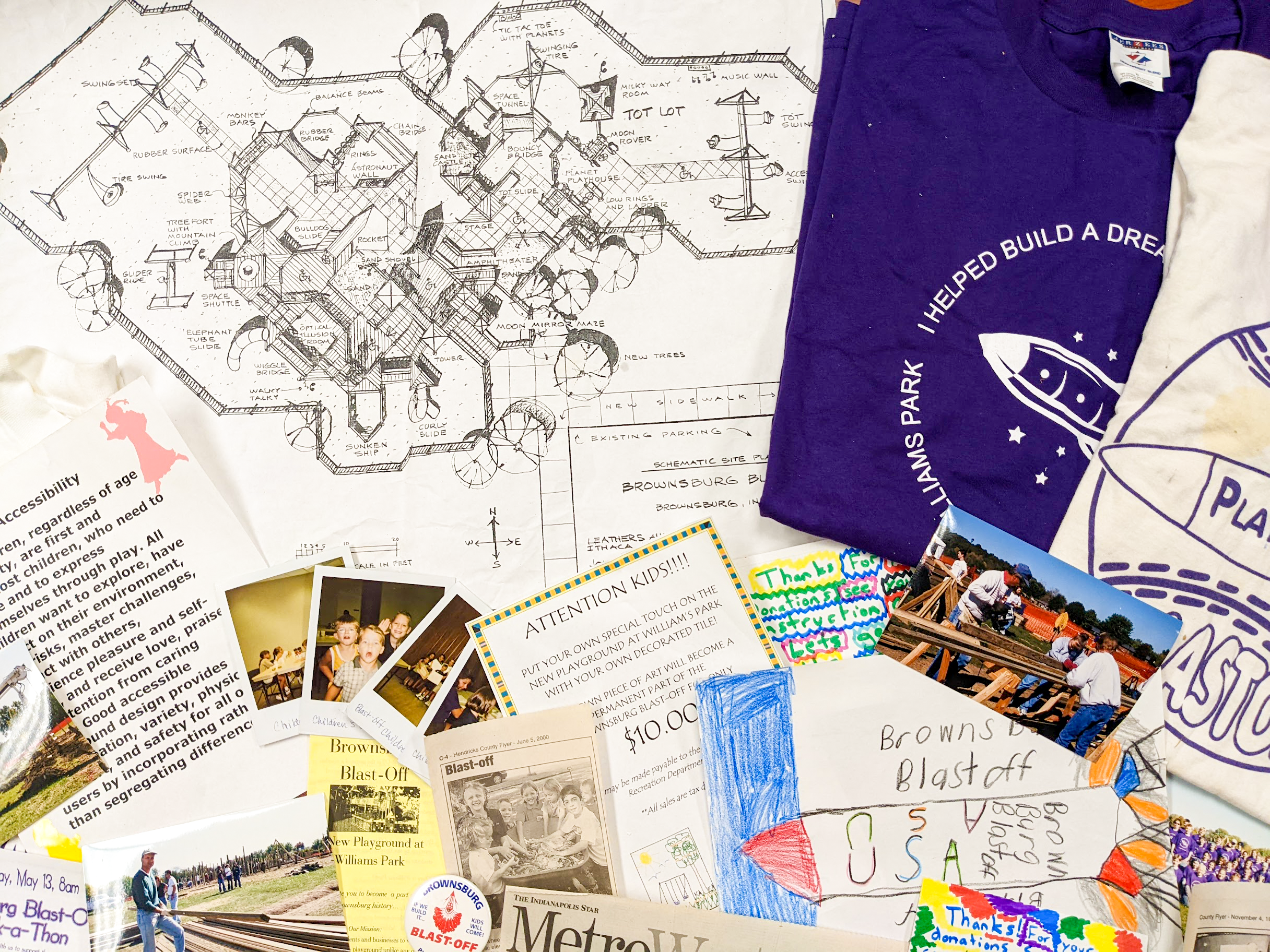 Items from Blast Off Playground's time capsule lay on a table.