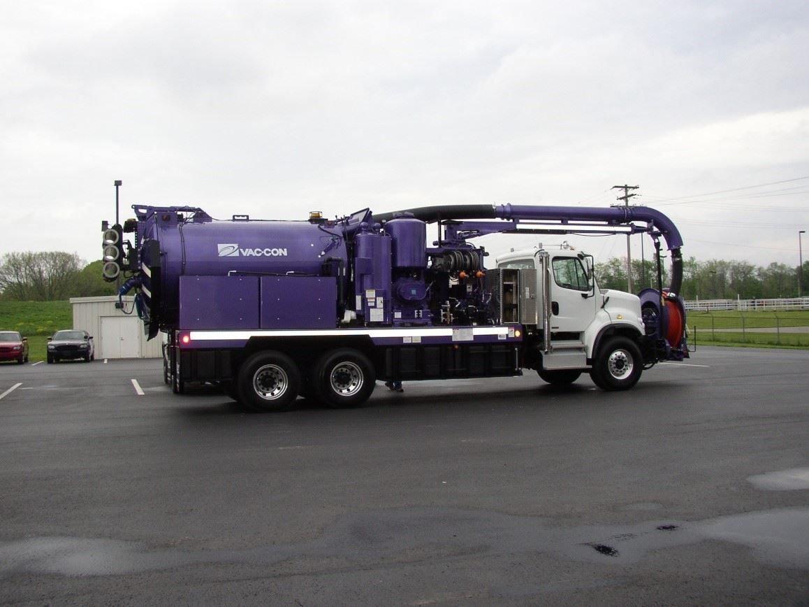 Large, purple sewer collection maintenance truck